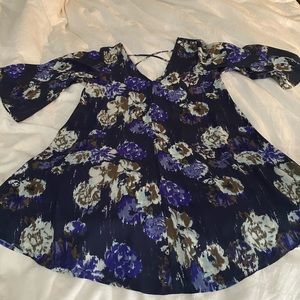 Leith SM mini dress. Floral design, 3/4 bell sleeve with crisscross back detail